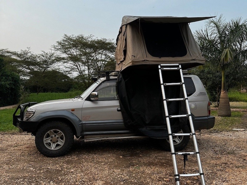 land cruiser prado with single rooftop tent
